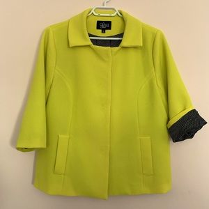 Cute neon yellow jacket with black polka dot lining